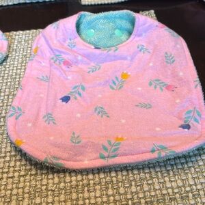 Handmade pink baby bib and burping towel.